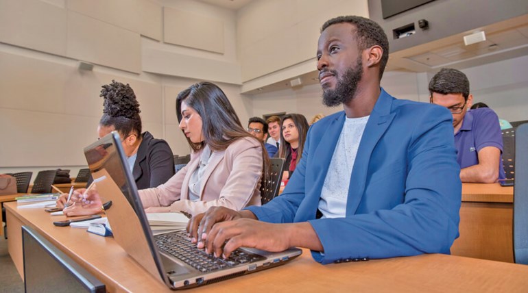 Students attending class in the classroom