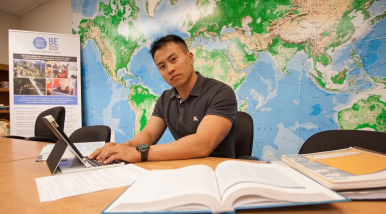 A student studying and taking notes