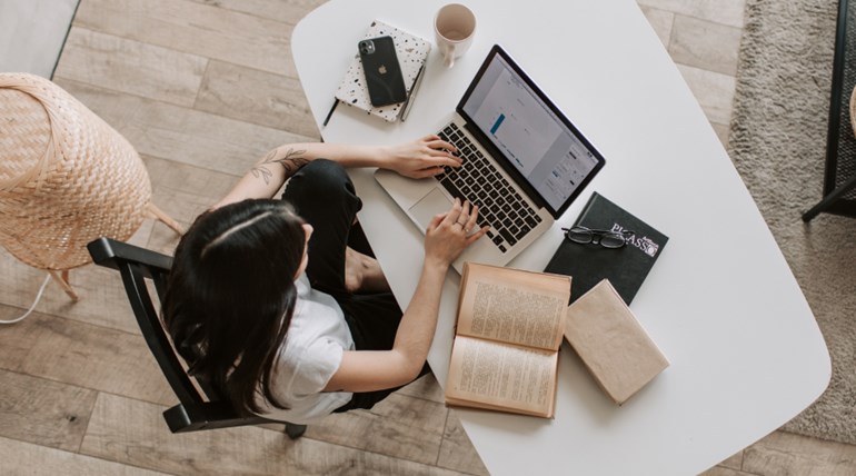 Woman Doing Research on Laptop