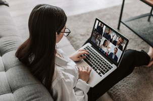 Woman Having a Online Group Meeting