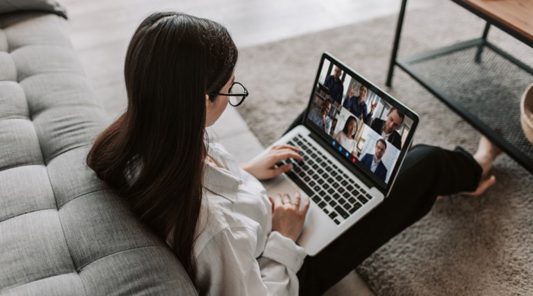Woman Having a Online Group Meeting