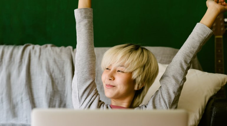 Student with arms stretched