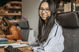 Student wearing a headphone and smiling