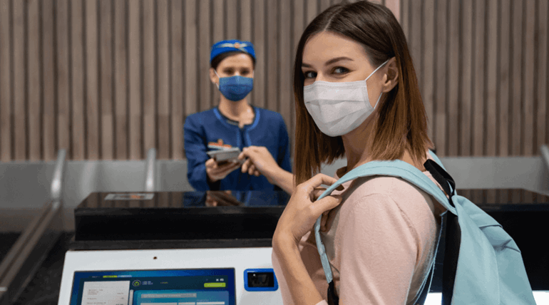 Woman looking at camera in the airport