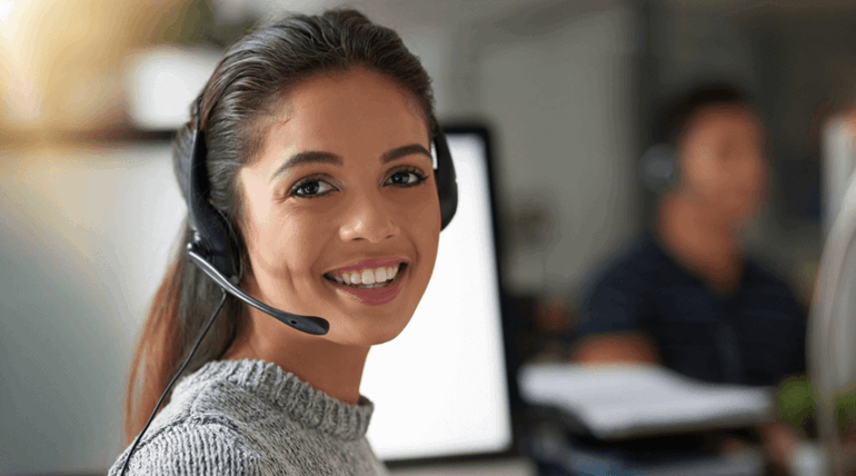 Woman wearing a headphone and smiling