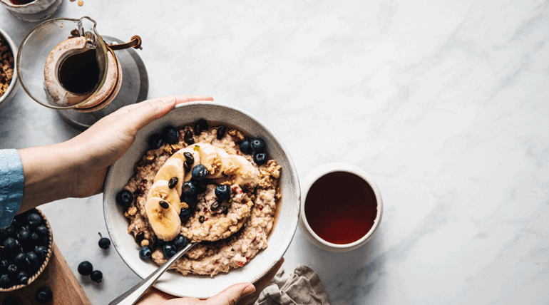 Holding a bowl of oatmeals