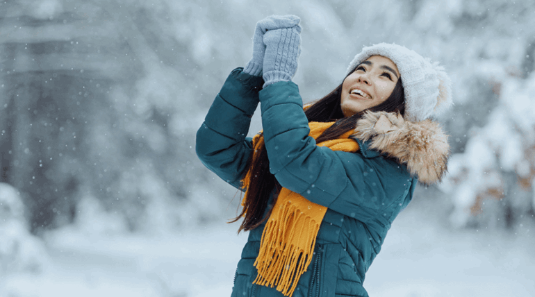 A woman standing in the snow