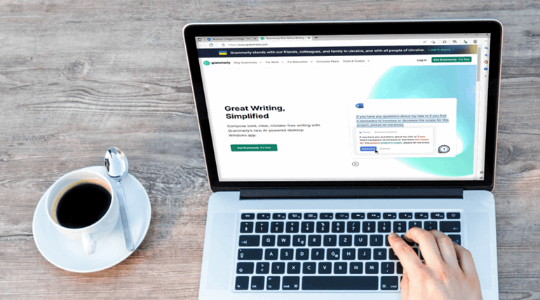 Student browsing Grammarly on laptop