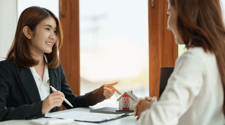 A woman explaining their services to a new student