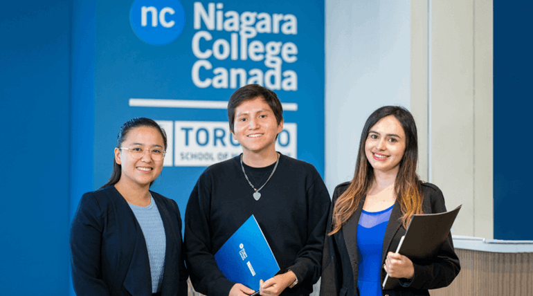 A group of students showing their happy smiles