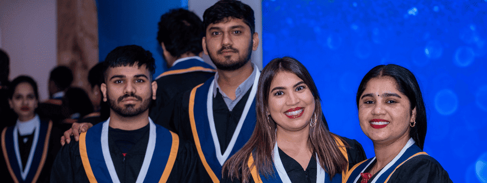 Graduates smiling together
